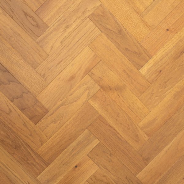 Aerial view of Blenheim Engineered Oak herringbone flooring with a golden brushed UV oiled finish, showcasing its elegant pattern and warm oak tones.