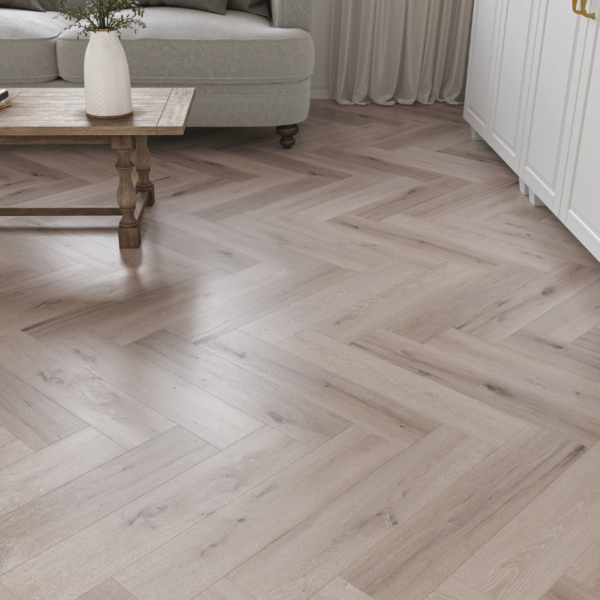 Close-up view of Devon LVT Herringbone White Wash Grey Oak plank with realistic wood grain texture and micro-beveled edges