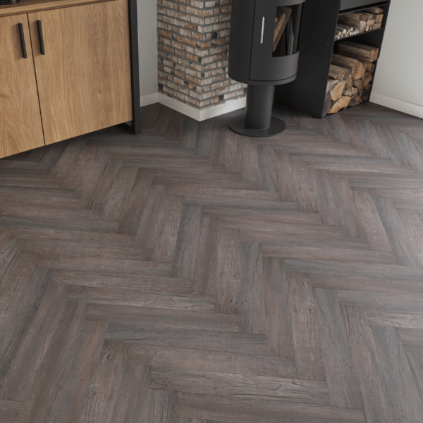 Close-up view of Dorset Herringbone Laminate Dark Chocolate Oak plank with rich wood grain texture and bevelled edges