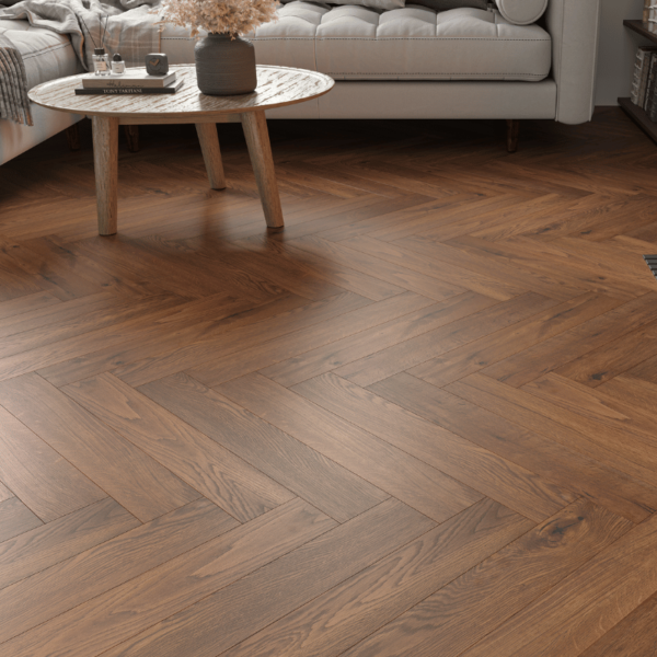 Close-up view of Dorset Herringbone Laminate Golden Brown Oak plank with rich tones and bevelled edges