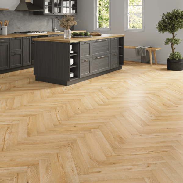Wide room view of Dorset Herringbone Laminate Light Natural Oak flooring with soft natural tones and bevelled edges