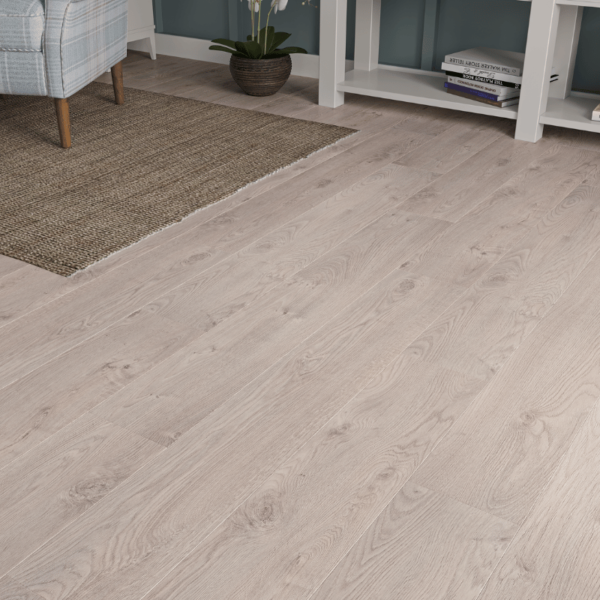 Close-up of Heritage Beige Oak 8mm laminate flooring with bevelled edges and natural wood grain