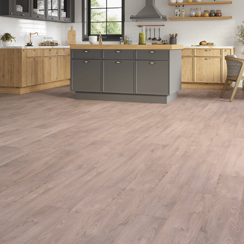 Heritage 8mm Medium Oak laminate flooring with natural wood grain and bevelled edges