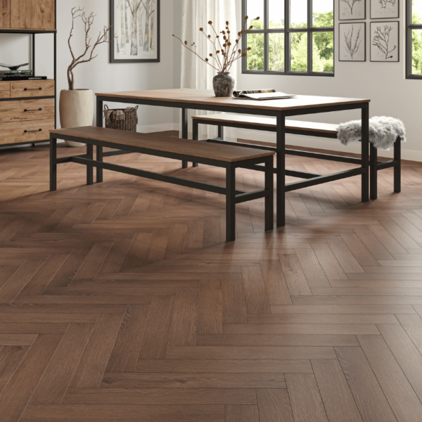 Prestige Herringbone 12mm Chocolate Oak laminate flooring in a spacious room with a rich herringbone design and bevelled edges