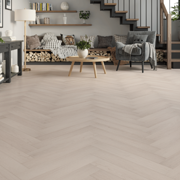Prestige Herringbone 12mm Cool Oak laminate flooring in a spacious room with a modern herringbone design and bevelled edges