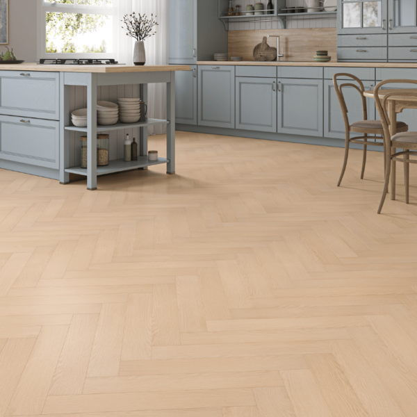 Prestige Herringbone 12mm Natural Oak laminate flooring in a spacious room with a classic herringbone pattern and bevelled edges