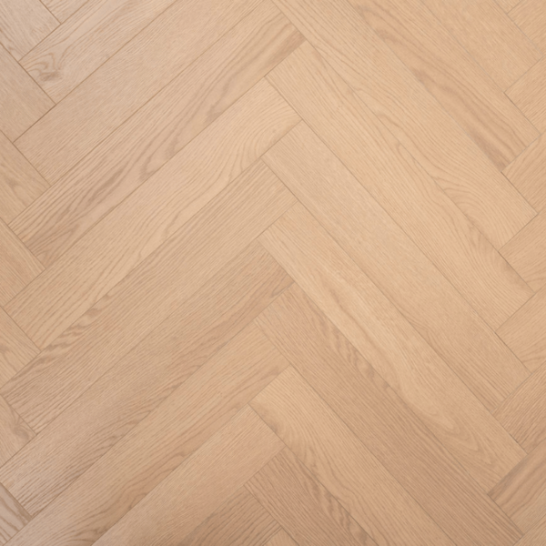 Aerial close-up of Prestige Herringbone 12mm Soft Oak laminate flooring plank, showcasing wood grain texture and V-groove edges