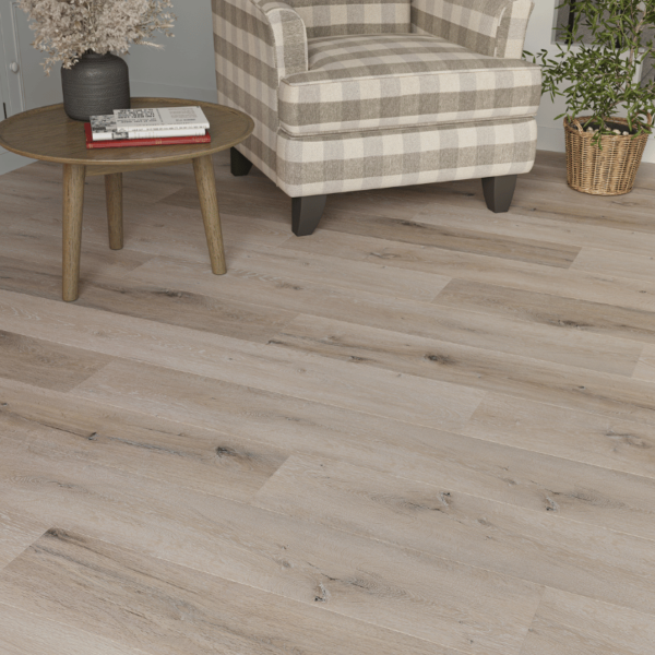 Close-up view of Surrey LVT White Wash Grey Oak plank with realistic wood grain texture and micro-beveled edges