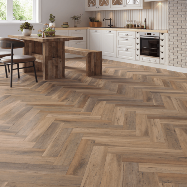 Wide room view of Wiltshire LVT Golden Brown Oak flooring with herringbone design and micro-beveled edges