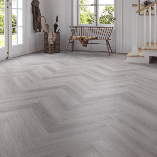Wide room view of Wiltshire LVT Grey Oak flooring with herringbone design and micro-bevelled edges
