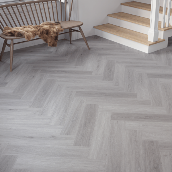 Close-up view of Wiltshire LVT Grey Oak plank with sleek wood grain texture and micro-bevelled edges