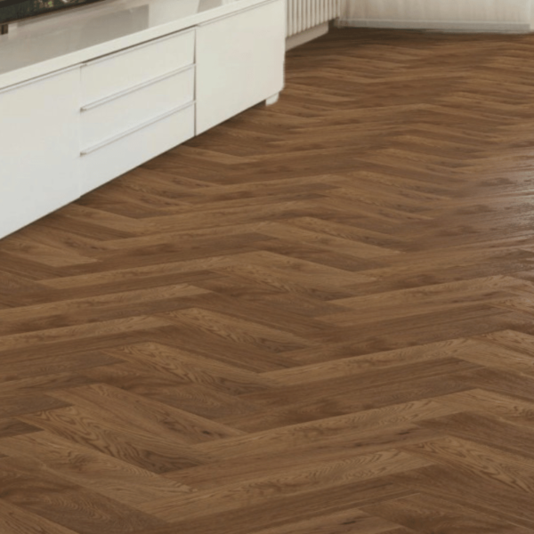 Close-up view of Ashbourne Herringbone Engineered Oak Flooring in Brushed Smoked Oiled, highlighting the textured wood grain and precise bevelled edges