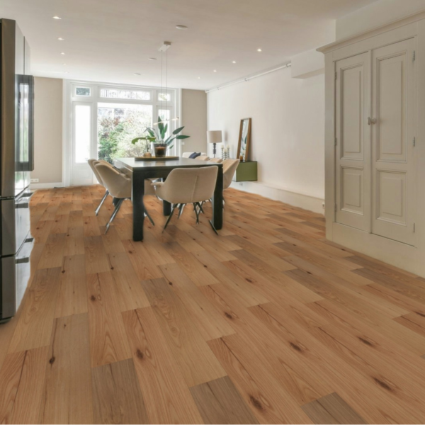 Wide room view of Bibury Engineered Oak Flooring in Smooth UV Lacquered, adding polished elegance and natural warmth to a bright, spacious room
