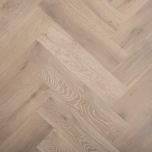 Top-down view of Buxton Herringbone Engineered Oak Flooring in Grey Brushed UV Lacquered with White Wash, showcasing the seamless herringbone pattern and textured finish
