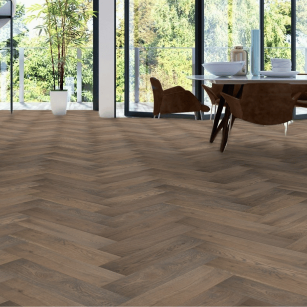 Wide room view of Castleton Herringbone Engineered Oak Flooring in Brushed Grey Stain UV Lacquered, adding elegance and soft grey tones to a spacious interior