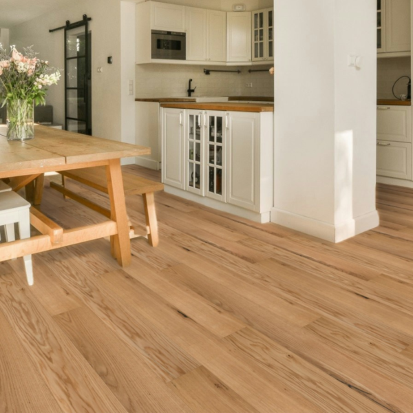 Wide room view of Cotswold Engineered Oak Flooring in Brushed UV Oiled, enhancing a spacious and elegant interior with warm natural tones
