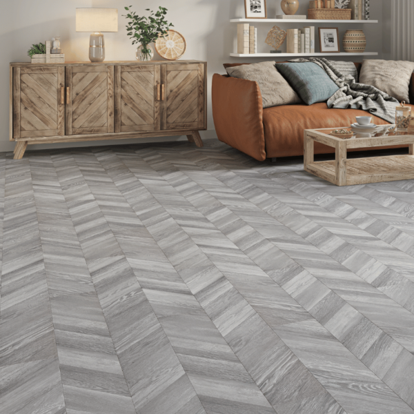 Wide room view of Madrid Chevron Laminate Grey Oak flooring with a sleek chevron design and bevelled edges