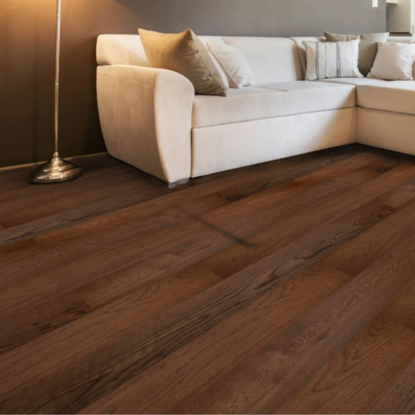Close-up view of Winchcombe Engineered Oak Flooring in Walnut Brushed UV Oiled, highlighting its deep walnut grain and precision bevelled edges