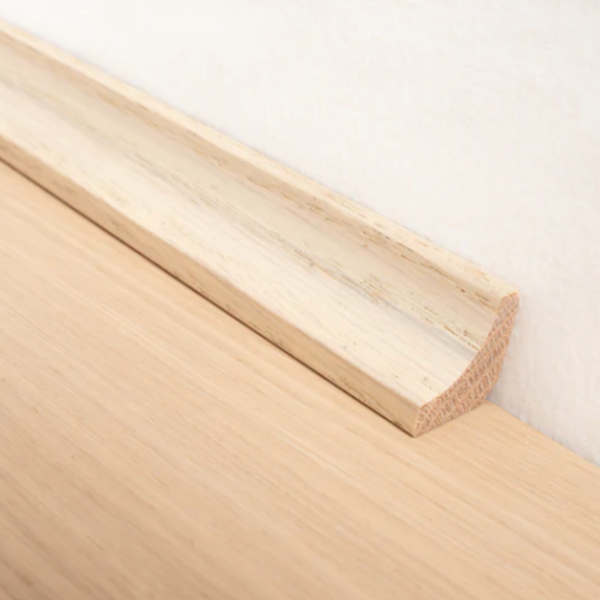 Invisible Oiled Solid Oak Scotia Beading for covering expansion gaps, offering a subtle, natural finish for wood flooring