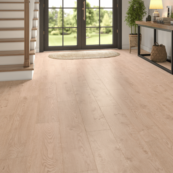Spacious, modern living room featuring Heritage Deluxe Laminate Light Oak 12mm flooring with a warm, natural woodgrain finish.