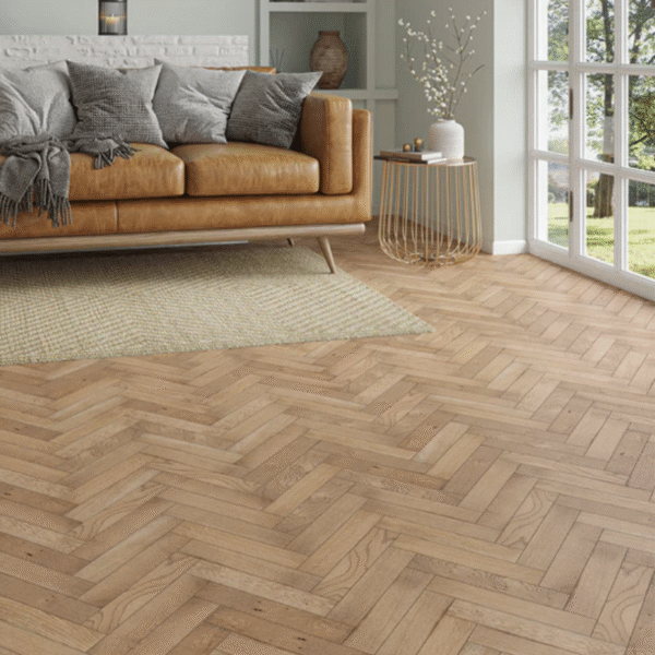 Living room with smoked oak herringbone flooring, leather sofa, and large windows showcasing Althorp Herringbone Engineered Oak